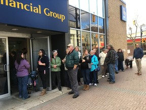 By 9:30 a.m., 48 people waited in front of the RBC branch on Front Street hoping to buy the BIA's downtown dollars. JONATHAN JUHA/STRATHROY AGE DISPATCH/POSTMEDIA NETWORK