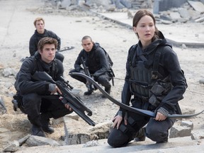 This image released by Lionsgate shows, from left, Liam Hemsworth as Gale Hawthorne, Sam Claflin as Finnick Odair,  Evan Ross as Messalla and Jennifer Lawrence as Katniss Everdeen in a scene from "The Hunger Games: Mockingjay Part 2." (Murray Close/Lionsgate)