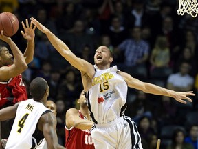 The London Lightning's Garrett Williamson defends against Darren Duncan of the Windsor Express during their NBL playoff game at Budweiser Gardens in London, Ont. on Saturday March 29, 2014. (Free Press file photo)
