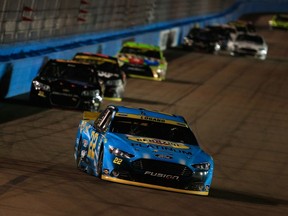 Joey Logano, driver of the #22 Pennzoil Ford, races during the NASCAR Sprint Cup Series Quicken Loans Race for Heroes 500 at Phoenix International Raceway on November 15, 2015 in Avondale, Arizona.  (Chris Trotman/AFP)