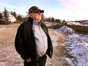 Norm Helm stands in front of road construction in front of his home on 12404 41 ave in Edmonton, Alta., on  Nov 19, 2015. Perry Mah/Edmonton Sun