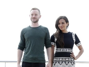 British actress Hannah John Kamen (R) and Canadian actor Aaron Ashmore (L) pose during a photocall for the TV show "Killjoys" at the MIPCOM audiovisual trade fair in Cannes, southeastern France, on October 6, 2015. Held each year on the French Riviera, the audiovisual trade fair brings together the movers and shakers of the global entertainment business to network, talk shop and buy, sell and finance new content. AFP PHOTO / VALERY HACHE