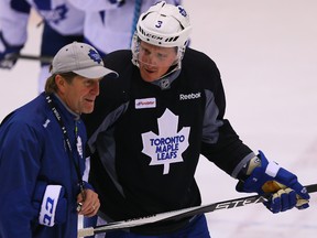 Dion Phaneuf talks to Coach Mike Babcock during Leafs practice at the Mastercard Centre in Toronto. (Dave Abel/Toronto Sun/Postmedia Network)