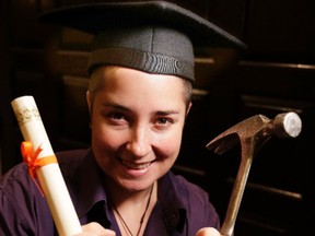 Carpenter Jane Davis poses with a diploma and hammer at The College of Carpenters & Allied Trades 2015 graduation ceremony. (Craig Robertson/Toronto Sun/Postmedia Network)