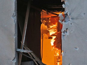View into the damaged building of Wednesday's raid on an apartment in the Paris suburb of Saint-Denis.(AP Photo/Christophe Ena)