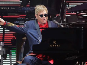 In this Oct. 25, 2015 file photo, Elton John performs following the Formula One U.S. Grand Prix auto race in Austin, Texas. John's longtime label Capitol Records dumped him after hearing his new album, Wonderful Crazy Night. (AP Photo/Eric Gay, File)
