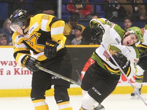 Kingston Frontenacs centre Conor McGlynn (81) clips Battalion player Danil Vertiy (23) midway through the third period during OHL action at the Memorial Gardens in North Bay on Thursday night. McGlynn received a five-minute check-to-the-head penalty and was ejected, but the Frontenacs killed that penalty as well as another one before holding on to beat North Bay 4-3. (Dave Dale/Postmedia Network)