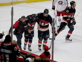 Senators forward Bobby Ryan leaves the ice after getting hit from behind during the third period action against the Columbus Blue Jackets on Thursday, Nov. 19, 2015. Tony Caldwell/Ottawa Sun/Postmedia Network