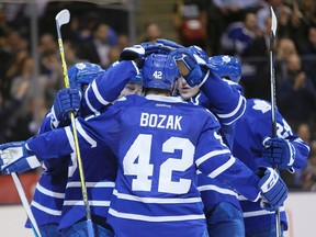 Toronto Maple Leafs forward Tyler Bozak (42) celebrates with teammates after scoring a goal against the Colorado Avalanche during the second period at the Air Canada Centre. John E. Sokolowski-USA TODAY Sports