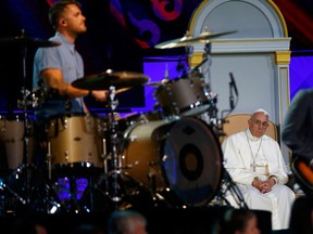 Pope Francis (rear) listens to The Fray perform at the Festival of Families rally in Philadelphia, Penn.,  in this Sept. 26, 2015 file photo.    REUTERS/Tony Gentile