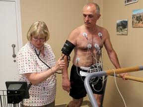 Kingston Whig-Standard multimedia journalist Paul Schliesmann undergoes testing with Annette Kemper, a electrodiagnosis ECG technician at Hotel Dieu Hospital for placement in their Cardiac Rehab Centre. Ian MacAlpine /The Kingston Whig-Standard/Postmedia Network