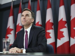 Federal Finance Minister Bill Morneau listens to a question during a news conference upon the release of the economic and fiscal update in Ottawa on November 20, 2015. REUTERS/Chris Wattie