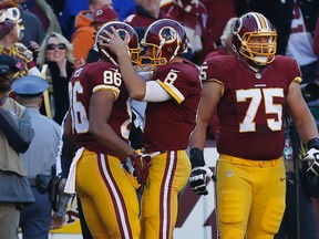 Washington Redskins tight end Jordan Reed (86) celebrates with Redskins quarterback Kirk Cousins (8) after scoring a touchdown against the New Orleans Saints in the first quarter at FedEx Field. Geoff Burke-USA TODAY Sports