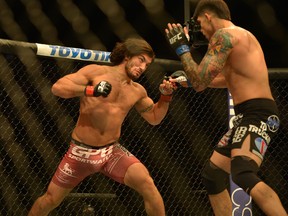 Elias Theodorou swings his fist against Roger Narvaez during UFC action in Dallas, TX. on Saturday March 14, 2015. (Patrick Green/Postmedia Network)