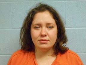 This file booking photo provided by the Stillwater Police Department shows Adacia Chambers, who is accused of running a red light and purposely driving around a barricade and over a police motorcycle before crashing into spectators at Oklahoma State University's homecoming parade. Legal experts say defense attorneys could have a difficult time proving that she is incompetent to stand trial. (Stillwater Police Department via AP, File)