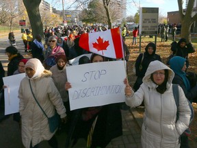 Members of the Flemingdon Park community rally against Islamophobia on Friday after a Muslim woman was attacked, robbed and racially insulted earlier this week. (Dave Abel/Toronto Sun/Postmedia Network)