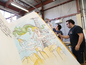 Alex Vincent, left, and Garrett Carr, of Cambrian College's Theatre Arts-Technical Production program, work on a float for the Greater Sudbury Santa Claus Parade at the college in Sudbury, Ont. on Friday November 20, 2015.The float is based on Robert Munsch's book, The Paper Bag Princess. The parade starts at 5:30 p.m. in downtown Sudbury. John Lappa/Sudbury Star/Postmedia Network
