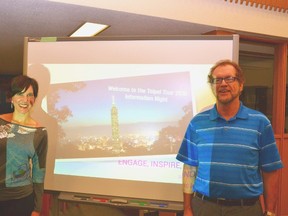 Carlene Hung (left), originally from Stratford and now residing in Taipei, Taiwan, and Steve Howe, the program manager for the international education program at the Avon Maitland District School Board, told a group of Mitchell District High School (MDHS) students and their parents about an exciting opportunity to travel to and explore Taipei for two weeks in March, 2016 at an information meeting in the school's library Nov. 19. GALEN SIMMONS/MITCHELL ADVOCATE