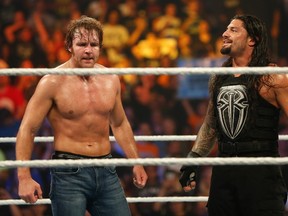 The WWE's Dean Ambrose (L) and Roman Reigns are both scheduled to appear at Survivor Series. (JP Yim/Getty Images/AFP)