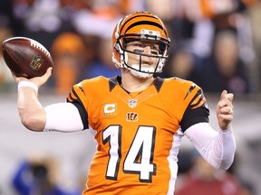 Andy Dalton #14 of the Cincinnati Bengals throws a pass during the fourth quarter of the game against the Houston Texans at Paul Brown Stadium on November 16, 2015 in Cincinnati, Ohio. Houston defeated Cincinnati 10-6.   Andy Lyons/Getty Images/AFP