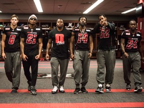 Ottawa REDBLACKS defensive backs Brandyn Thompson (25), Antoine Pruneau (6), Brandon Sermons (21), Jovon Johnson, Abdul Kanneh (14), Jermaine Robinson (32) and Jerrell Gavins (24) in the locker room at TD Place stadium. Saturday, November 21, 2015. (PHOTO: JOHANY JUTRAS)