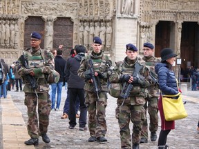 Soldiers patrol outside Notre Dame Cathedral in Paris on Nov. 21, 2015. (Vivian Song/Special to the Toronto Sun)