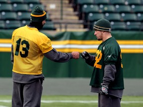 Eskimos Mike Reilly and J.C. Sherritt during Edmonton Eskimos practice at Commonwealth Stadium on November 21.
Photo by: Perry Mah/Edmonton Sun