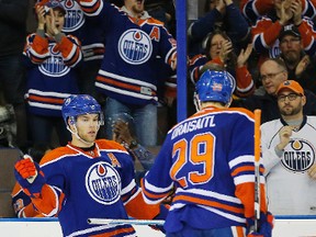 Edmonton Oilers forward Taylor Hall (4) celebrates his third period goal against the New Jersey Devils at Rexall Place. Perry Nelson-USA TODAY Sports