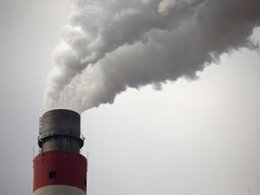 Smokestack at coal fired power generating station (Mark Schiefelbein/AP)