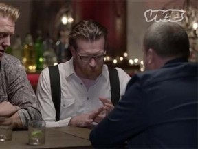 Josh Homme, left, and Jesse Hughes of the band Eagles of Death Metal sat down for an interview with Vice founder Shane Smith, right, for an interview set to air on its website next week. (Vice/YouTube)