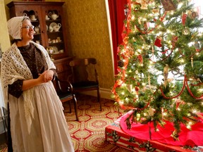 Head curator Jennifer Lyons speaks to guests about Christmas traditions – including the Christmas pickle – during Wassail by Candlelight at the Macaulay Heritage Park on Saturday November 21, 2015 in Picton, Ont. Emily Mountney-Lessard/Belleville Intelligencer/Postmedia Network