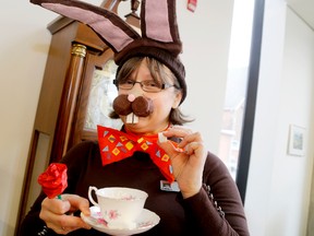 Beverly Kay of the Belleville Public Library takes part in a scavenger hunt there as part of the Alice in Wonderland 150th anniversary celebrations, on Saturday November 21, 2015 in Belleville, Ont. Emily Mountney-Lessard/Belleville Intelligencer/Postmedia Network