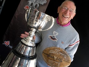 CFL great Russ Jackson holds the game ball of the 1909 Gray Cup back in 2012. Dave Thomas/Postmedia Network