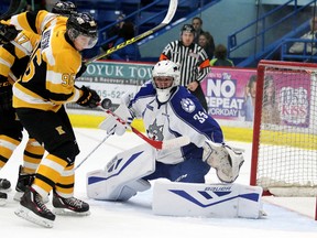 Kingston Frontenacs Spencer Watson tries to redirect the loose puck past Sudbury Wolves goalie Zack Bowman during first period OHL action from the Sudbury Community Arena  in Sudbury, Ont. on Sunday November 22, 2015. Gino Donato/Sudbury Star/Postmedia Network