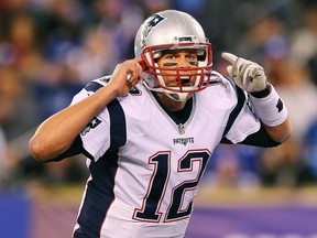 Tom Brady #12 of the New England Patriots calls the play out to his team against the New York Giants during the first quarter at MetLife Stadium on November 15, 2015 in East Rutherford, New Jersey.   Elsa/Getty Images/AFP