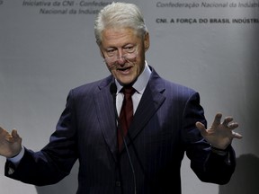 Former U.S. President Bill Clinton speaks during the closing ceremony of the 10th National Industry Meeting (ENAI) at the International Convention Centre of Brazil, in Brasilia, Brazil November 12, 2015. (REUTERS/Joedson Alves)