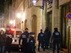 Police patrol during an operation in the centre of Brussels on Sunday, Nov. 22, 2015. Western leaders stepped up the rhetoric against the Islamic State group on Sunday as residents of the Belgian capital awoke to largely empty streets and the city entered its second day under the highest threat level. With a menace of Paris-style attacks against Brussels and a missing suspect in the deadly Nov. 13 attacks in France last spotted crossing into Belgium, the city kept subways and underground trams closed for a second day. (AP Photo/Virginia Mayo)