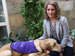 Vernon, the new Kingston Police canine assisted intervention dog, with his handler Det. Const. Melanie Jefferies in Kingston, Ont. on Sunday November 22, 2015. Vernon arrived at his post on Oct. 5 and was put straight to work. Steph Crosier/Kingston Whig-Standard/Postmedia Network