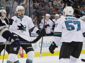 San Jose Sharks' Brendon Dillon, left, celebrates his goal against the Columbus Blue Jackets during the third period of an NHL hockey game Sunday, Nov. 22, 2015, in Columbus, Ohio. The Sharks defeated the Blue Jackets 5-3. (AP Photo/Jay LaPrete)