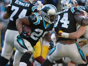 Carolina Panthers' Jonathan Stewart (28) runs against the Washington Redskins in the second half of an NFL football game in Charlotte, N.C., Sunday, Nov. 22, 2015. (AP Photo/Bob Leverone)