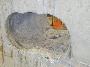 This is a an undated image made available on Wednesday April 22, 2015 by the Metropolitan Police of the hole  leading into the vault at the Hatton Garden Safe Deposit company which was robbed over the Easter weekend. (Metropolitan Police via AP)