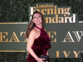 Kelly Brook holds her dress down on the red carpet at the Evening Standard Theatre Awards on Sunday, November 22, 2015. (WENN.COM)