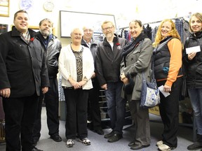 Representatives from local churches pose at the Community Closet with cheques on Thursday, Nov. 19. Also pictured, second from right, is Carmen Zayac of the Vermilion Girl Guides. The Community Closet also donated $500 each to the Boy Scouts and Girl Guides.