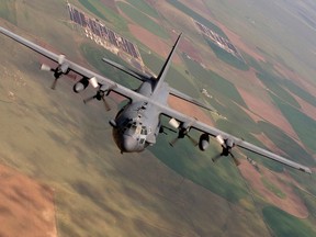 This photo provided by the U.S. Air Force, taken Aug. 11, 2010, shows an AC-130 Spectre from the 16th Special Operations Squadron flying a training mission at Cannon Air Force Base, N. M. Two AC-130 gunships and four A-10 attack planes destroyed 283 Islamic State oil trucks. (U.S. Air Force photo/Master Sgt. Jack Braden via AP)