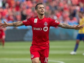 Toronto FC's Sebastian Giovinco celebrates after scoring his team's second goal against Colorado Rapids during first half MLS action in Toronto on Saturday, September 19, 2015. THE CANADIAN PRESS/Chris Young