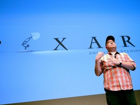 US director at Pixar Animation Studios, Peter Sohn, presents Pixar's latest film The Good Dinosaur, directed by Sohn, during the Annecy International Animated Film Festival in Annecy, French Alps, on June 16, 2015. The festival is held from June 15 to 20, 2015.   AFP PHOTO/JEAN-PIERRE CLATOT