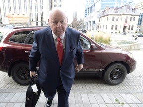 <Sen. Mike Duffy, a former member of the Conservative caucus, makes his way to the courthouse as his trial resumes, Thursday Nov. 19, 2015 in Ottawa. 
THE CANADIAN PRESS/Adrian Wyld