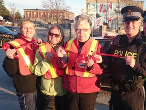 MADD Huron-Bruce launched its annual Red Ribbon campaign with the help of South Bruce and Huron OPP officers in Lucknow Nov. 18, 2015. Pictured: L-R: MADD volunteers Catherine Beyersbergen (co-president), Laurie Dinning, and Barb Rintoul (co-president, MADD board member and Huron OPP Sgt. Russ Nesbitt, OPP Provincial Constable Mike Barnes, and Huron OPP Inspector Jason Younan. (Troy Patterson/Kincardine News)