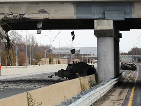 Traffic was being diverted off Highway 402 after a truck crashed into the Indian Road overpass in Sarnia Monday. Police said the vehicle was carrying a load too tall for the corridor. (Tyler Kula, Sarnia Observer)