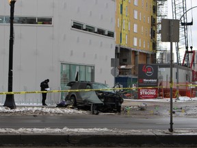 An SUV crashed into a building on Portage Avenue around 1:30 a.m. Monday, Nov. 23, 2015, causing injuries that killed a 27-year-old woman. Police say officers suspected the vehicle was involved in a robbery and attempted to pull it over about 10 minutes earlier, when it sped away, leading police to lose sight of it. The woman, who was allegedly driving the vehicle, was fatally wounded and rushed to hospital in critical condition, where she died. Her male passenger was arrested after fleeing the scene on foot, police say.